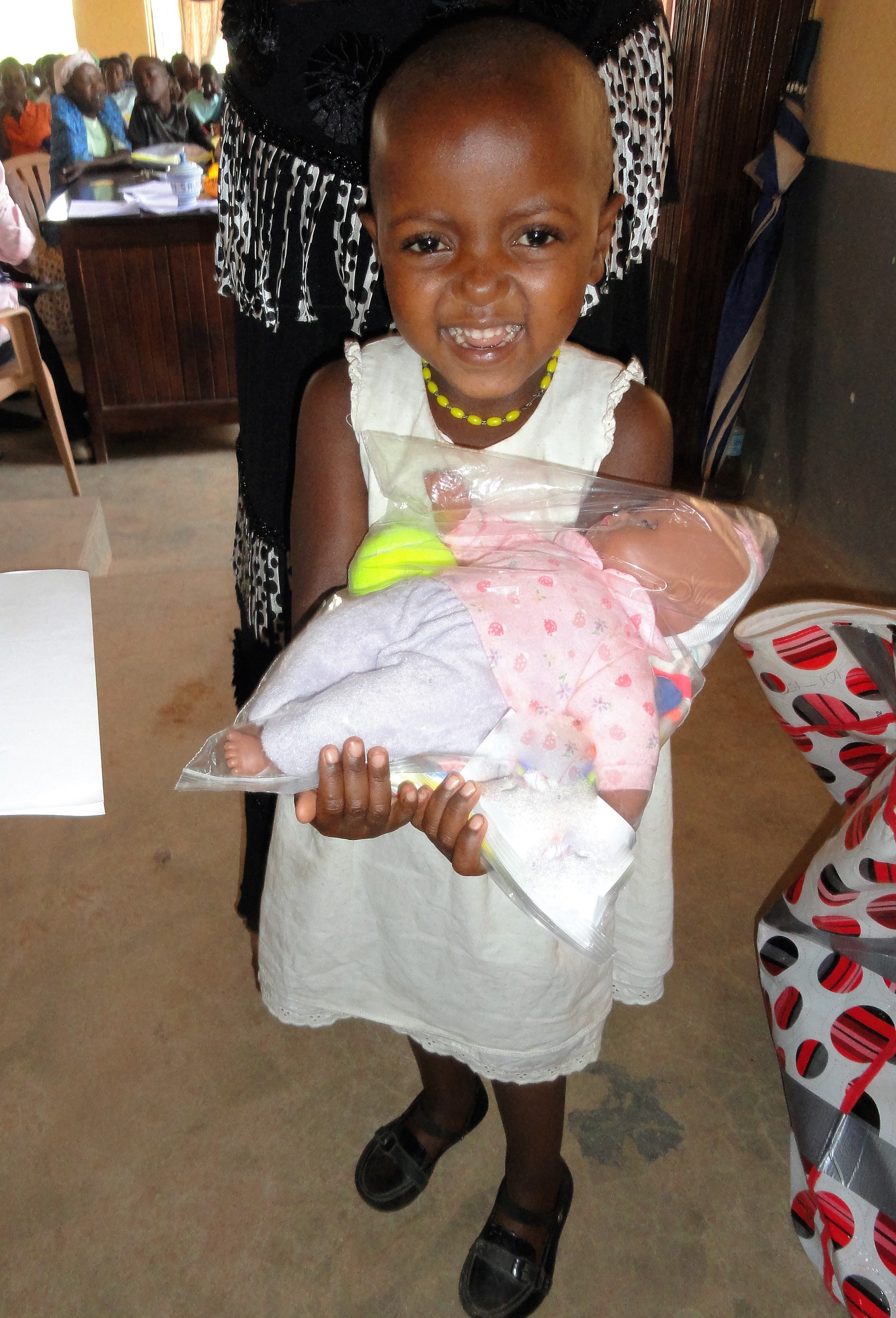 Excited to receive a gift from her sponsor